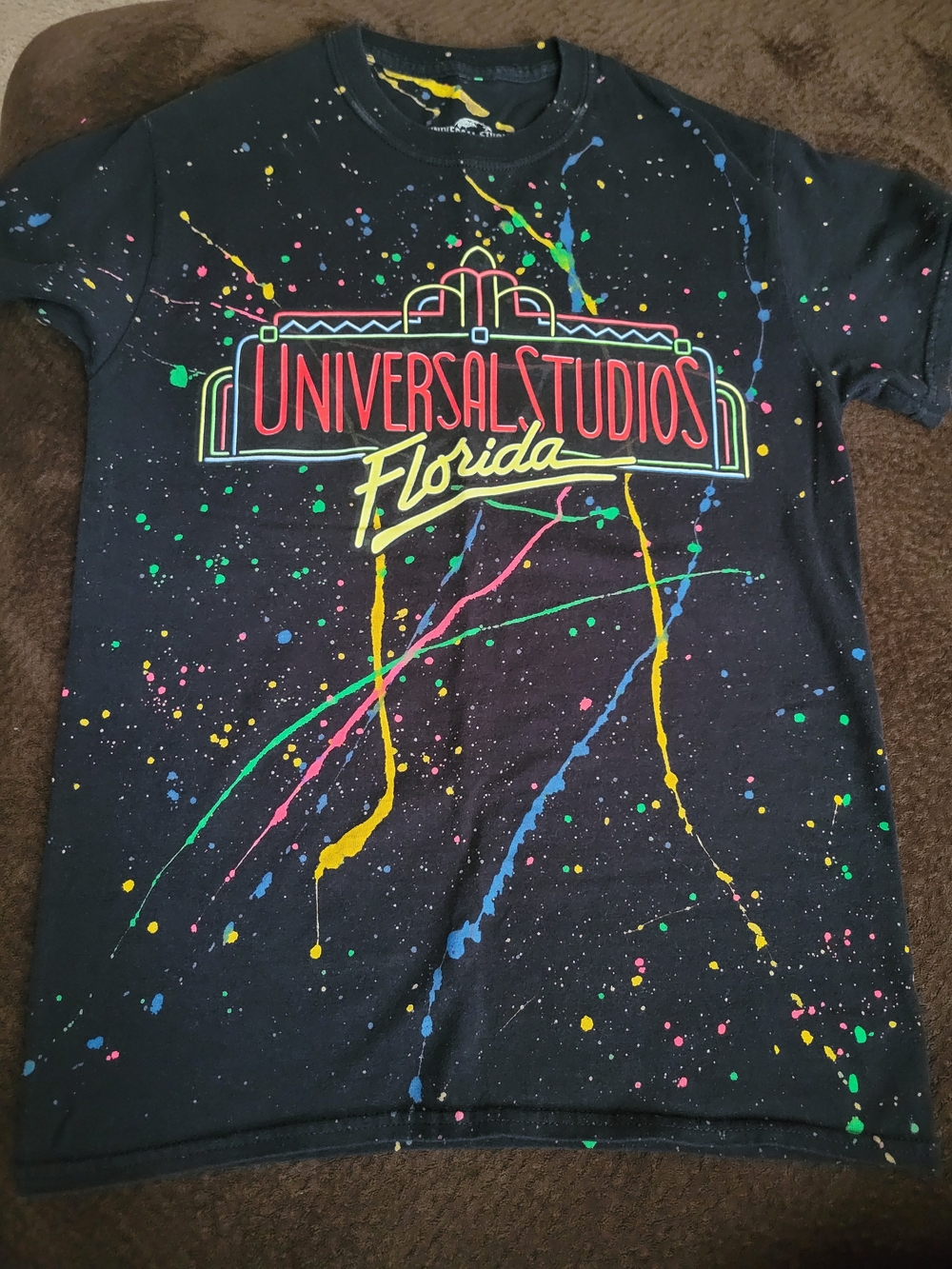 Universal Womens Black Tee with Neon Paint-Splash Graphic